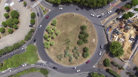 Fix-drone-vertical-view-over-a-roundabout-in-France.-Traffic-urban-zone